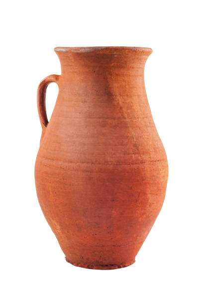 istock Single antique clay brown weathered and scratched vase with handle isolated on white background. Clipping path - image 1089395082