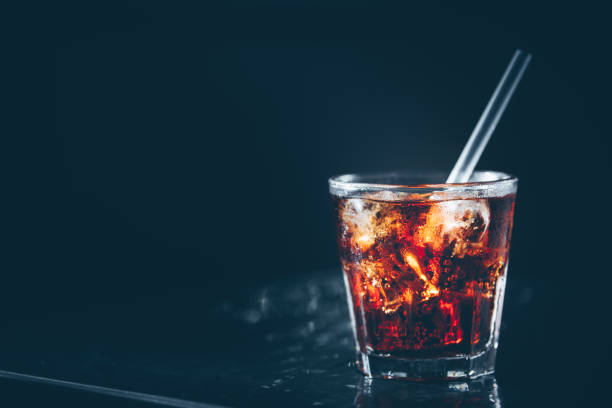 istock Cuba libre cocktail at the bar stand. Dark background 1089401712