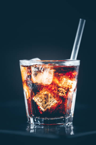 istock Cuba libre cocktail at the bar stand. Dark background 1089401738