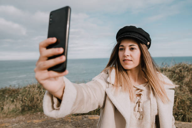 istock Young woman taking her selfie picture 1089402510