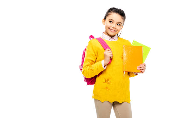 istock adorable child with backpack holding books and smiling isolated on white 1089410472