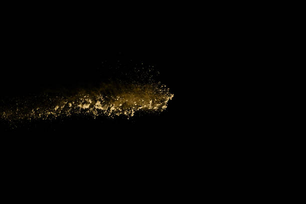 istock Golden powder explosion on black background. Freeze motion. 1089413774