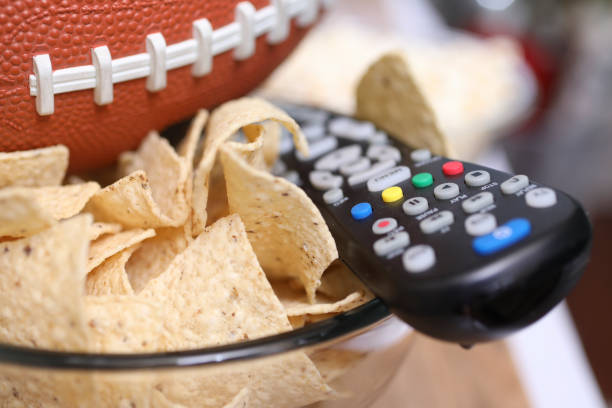 istock Watching the football game with snacks. 1089414390
