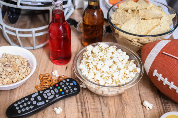 istock Watching the football game with snacks, drinks. 1089414434
