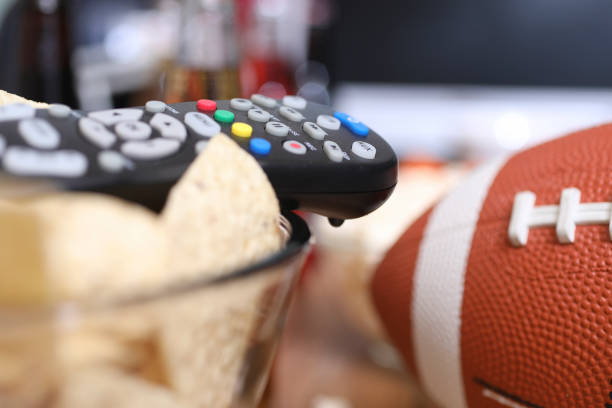 istock Watching the football game with snacks. 1089414446