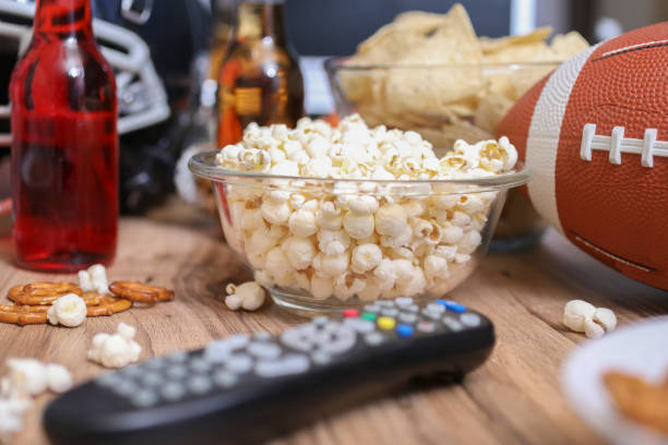 istock Watching the football game with snacks, drinks. 1089414468