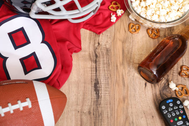 istock Watching the football game with snacks, drinks. 1089414592