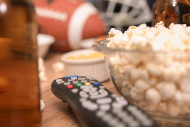 istock Watching the football game with snacks, drinks. 1089414608
