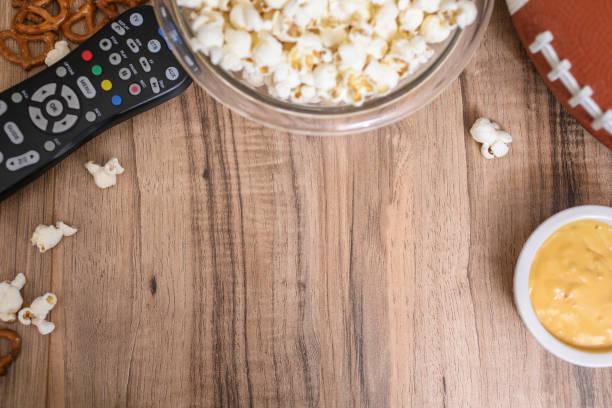 istock Watching the football game with snacks, drinks. 1089414690