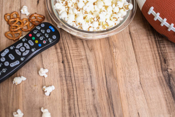 istock Watching the football game with snacks, drinks. 1089414712