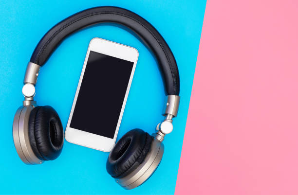istock Blank Mobile phone screen inside of Golden headphone 1089419578