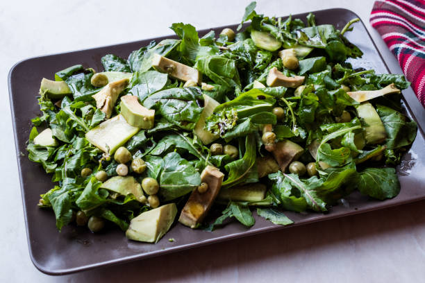 istock Avocado Salad with Green Peas and Rocket Leaves in Rectangular Plate / Arugula or Rucola Leaves. 1089422194