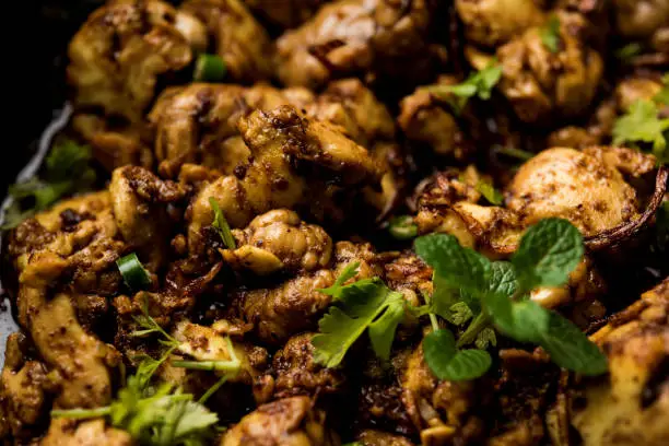 Photo of Brain / Bheja Fry of goat, sheep or lamb is a popular Indian or pakistani dish cooked on Bakra Eid(Eid-ul-zuha). served in karahi, pan or plate. selective focus