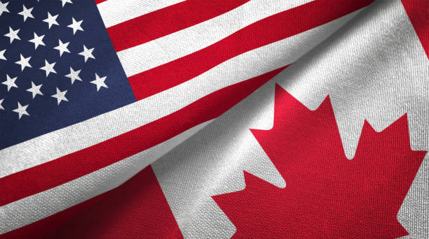 istock Canada and United States two flags together realations textile cloth fabric texture 1089423322