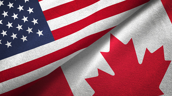 Canada and United States flags together realtions textile cloth fabric texture