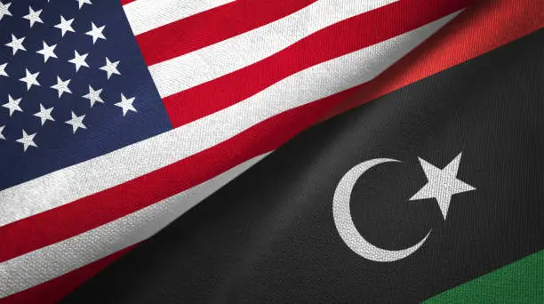 Photo of Libya and United States two flags together realations textile cloth fabric texture