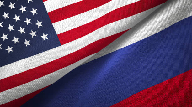 rusland en de verenigde staten twee vlaggen samen realations textiel doek stof textuur - rusland stockfoto's en -beelden