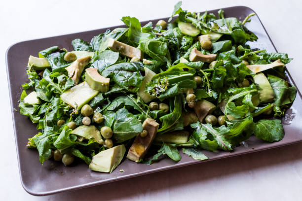 istock Avocado Salad with Green Peas and Rocket Leaves in Rectangular Plate / Arugula or Rucola Leaves. 1089429934