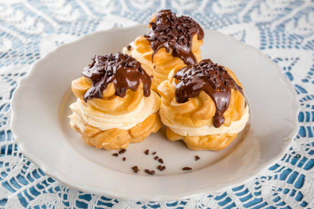 Profiterole Cream Puff with chocolate Profiterole Cream Puff with chocolate cream cake stock pictures, royalty-free photos & images