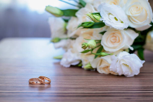 istock Gold wedding rings and bridal bouquet 1089434210