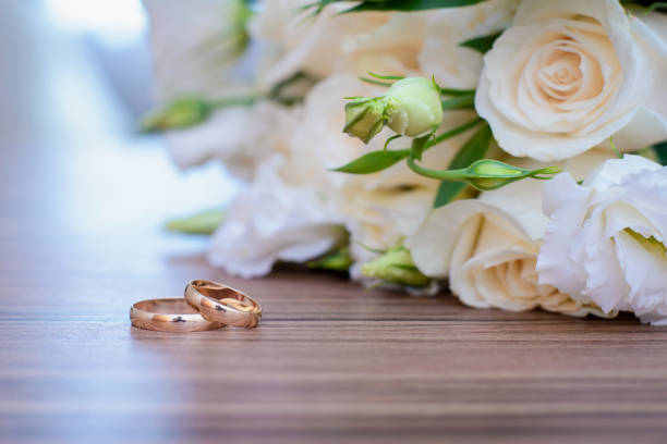 istock Gold wedding rings and bridal bouquet 1089435022