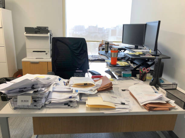 Chaotic desk in office stock photo