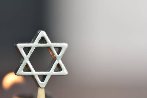 star of david on a candle background - hanukkah menorah judaism religion imagens e fotografias de stock