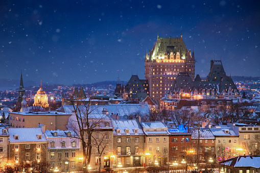 Elevated view of the Quebec City skyline at night on a snowy Winter night, looking towards the old city and the Chateau Frontenac