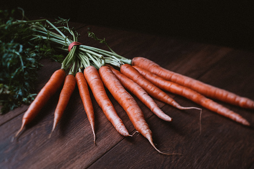 A bunch of fresh raw carrots with stems