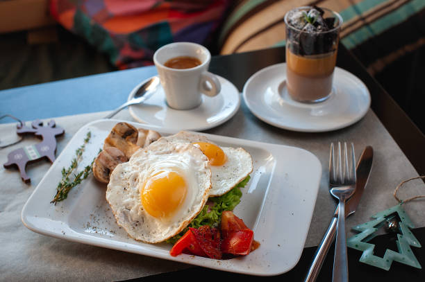 istock New Year's breakfast. Fried eggs, coffee and dessert. 1089451294