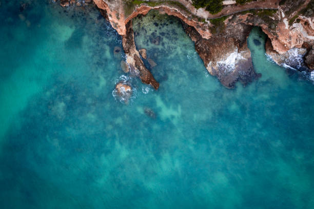 Aerial image of the sea at winter, rocky coast, birds eye view stock photo