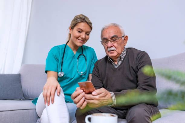istock Young nurse spending time with happy elder patient in nursing home 1089458554