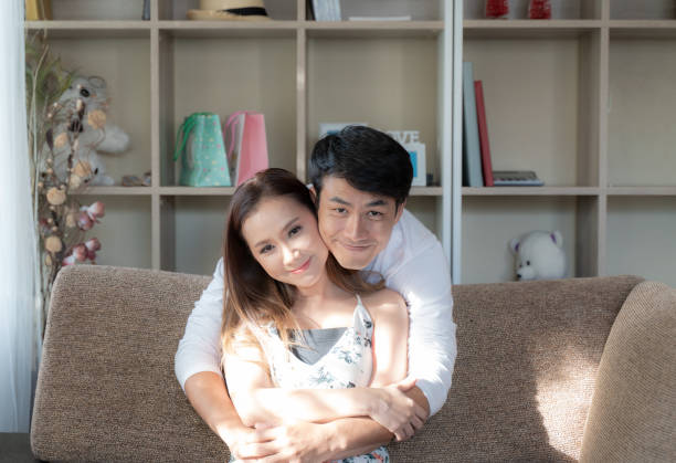 istock Sweet couple smiling and embracing together 1089463586
