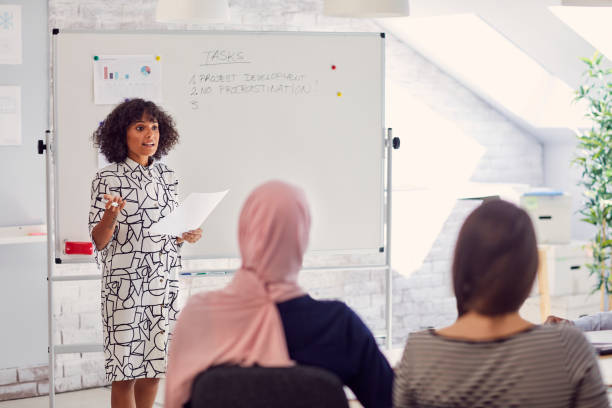 istock African Woman Holding Presentation 1089467322