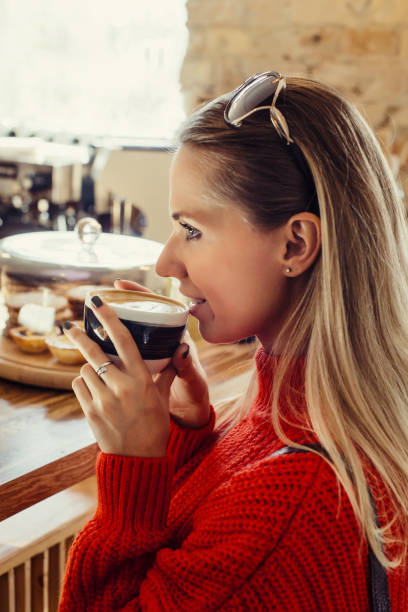 istock Happy woman enjoying some coffee in a cafeteria 1089467808