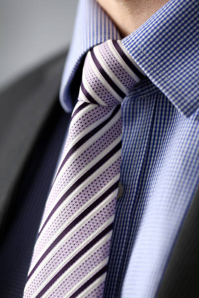 istock Business man in black suit set tie closeup 1089473476