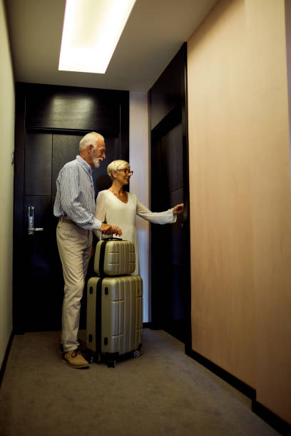 istock Senior Couple Coming To A Hotel 1089474678