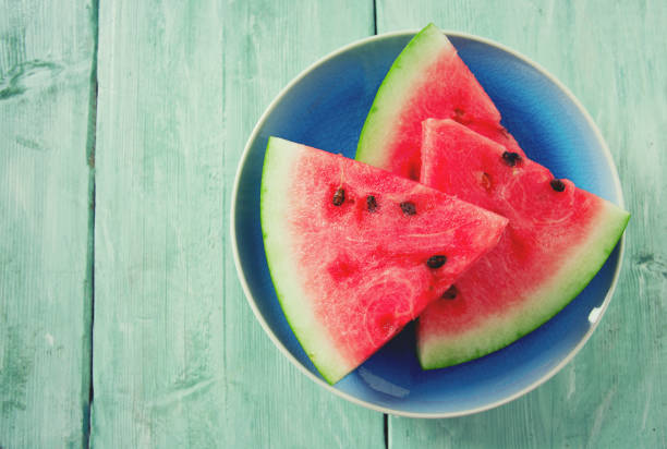 istock freshly cut water melon on wooden table 1089476910
