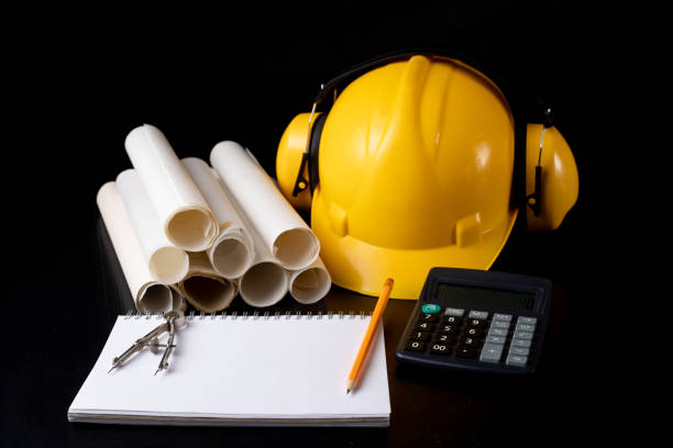 istock Engineer's desk prepared for work. Accessories prepared for a builder on a black table. Dark background. 1089477726
