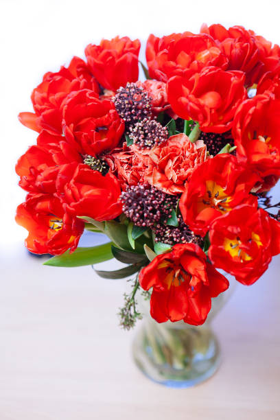 istock Bouquet  with red tulips in vase 1089480214