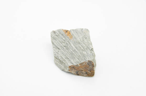 extreme close up with a lot of details of phyllite rock isolated over white background