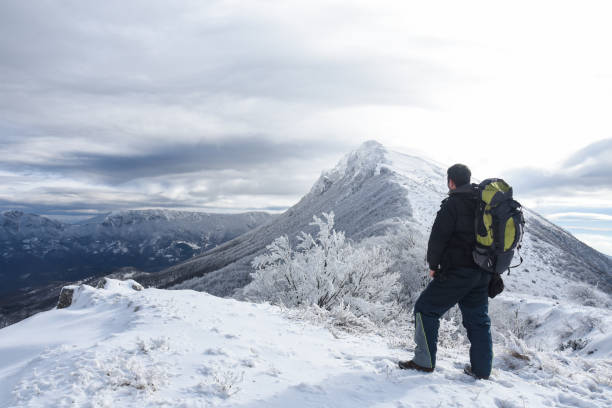 istock Hiker in a winter mountains. Winter background 1089483108