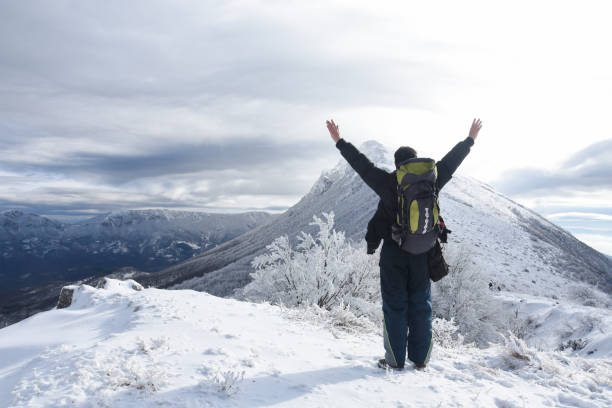 istock Hiker in a winter mountains. Winter background 1089483528