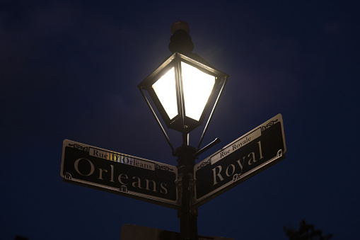 Orleans and Royal street sign and lamp in the French quarter.