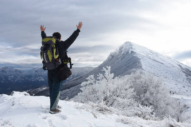 istock Hiker in a winter mountains. Winter background 1089486070