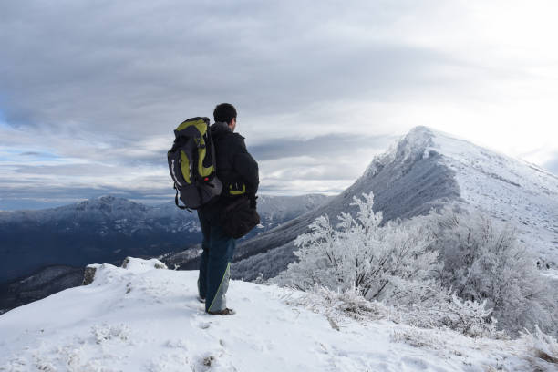 istock Hiker in a winter mountains. Winter background 1089486076