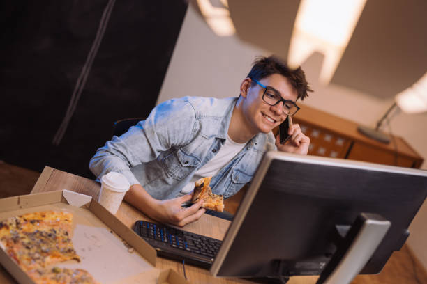 istock late night work from home and pizza snack 1089487720