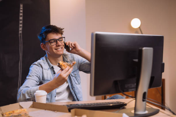 istock late night work from home and pizza snack 1089488058