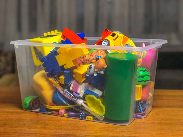 istock box with children's toys on the table during games 1089489176