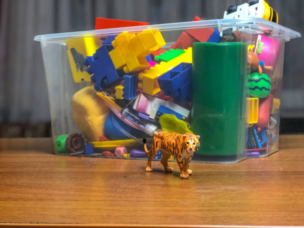istock box with children's toys on the table during games 1089489536